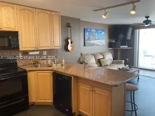 a kitchen with a sink cabinets and window