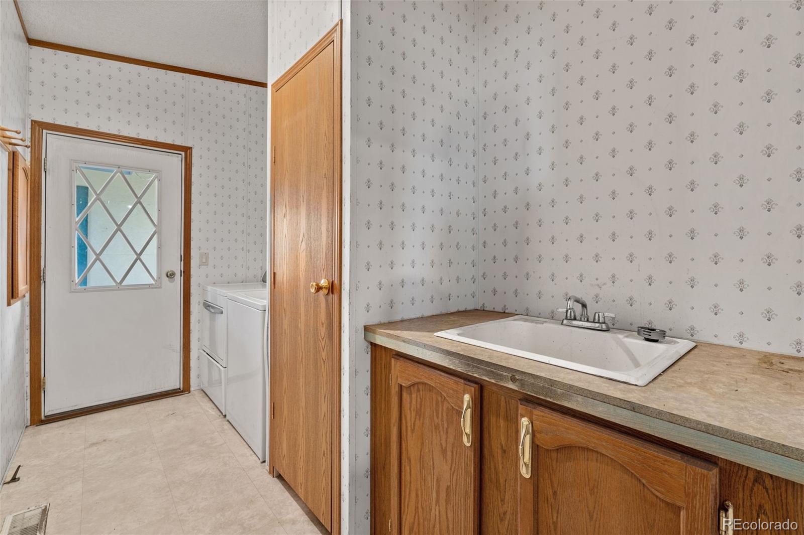 1711 Witcher Mtn. Road Guffey, CO 80820 - Photo 17 of 41 a bathroom with a sink and a mirror