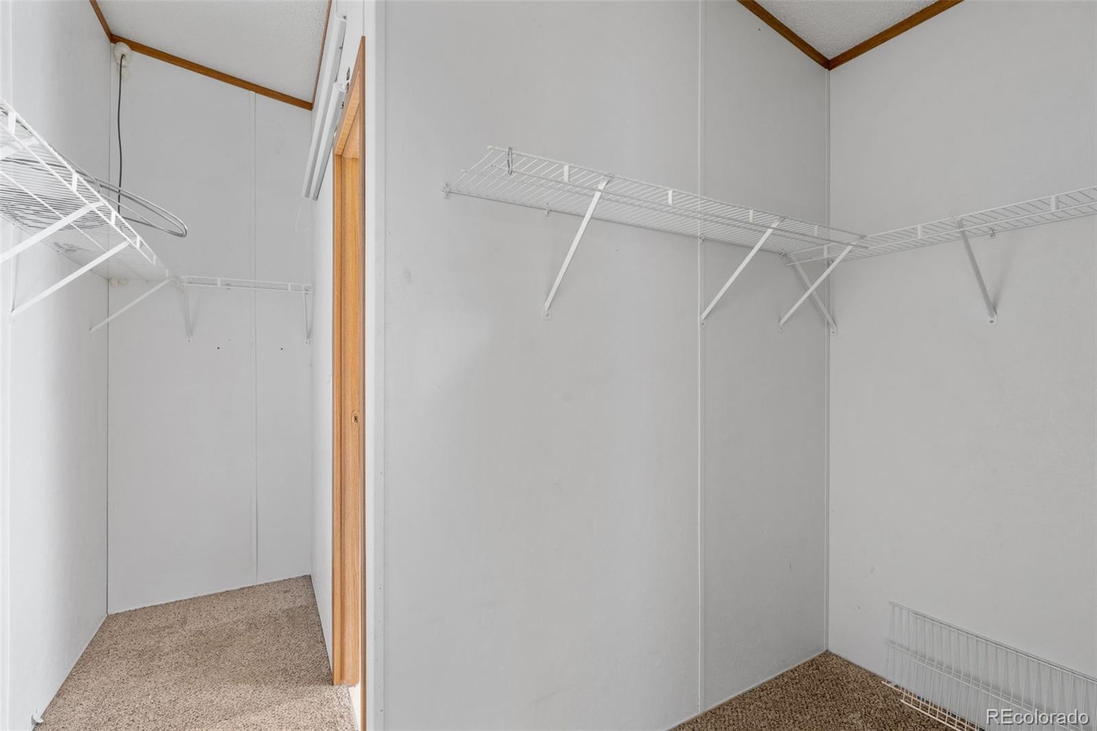 1711 Witcher Mtn. Road Guffey, CO 80820 - Photo 23 of 41 a view of a room with racks on the wall