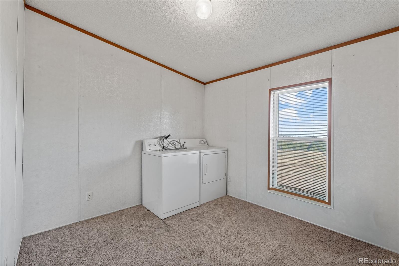 1711 Witcher Mtn. Road Guffey, CO 80820 - Photo 27 of 41 a room with storage and utility