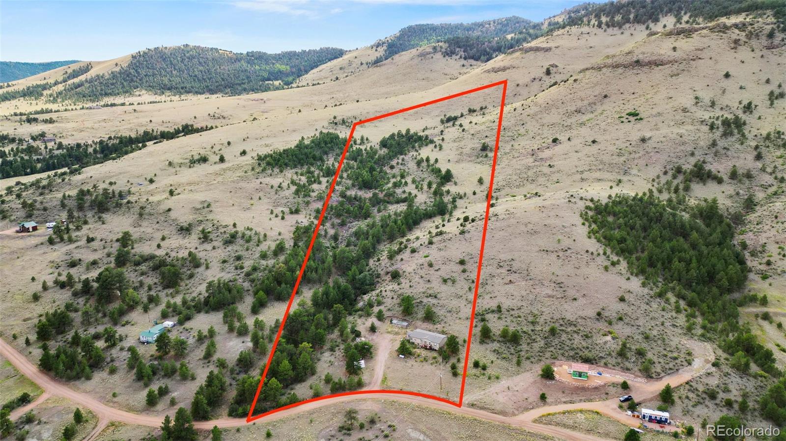 1711 Witcher Mtn. Road Guffey, CO 80820 - Photo 34 of 41 a view of a dry yard with wooden fence