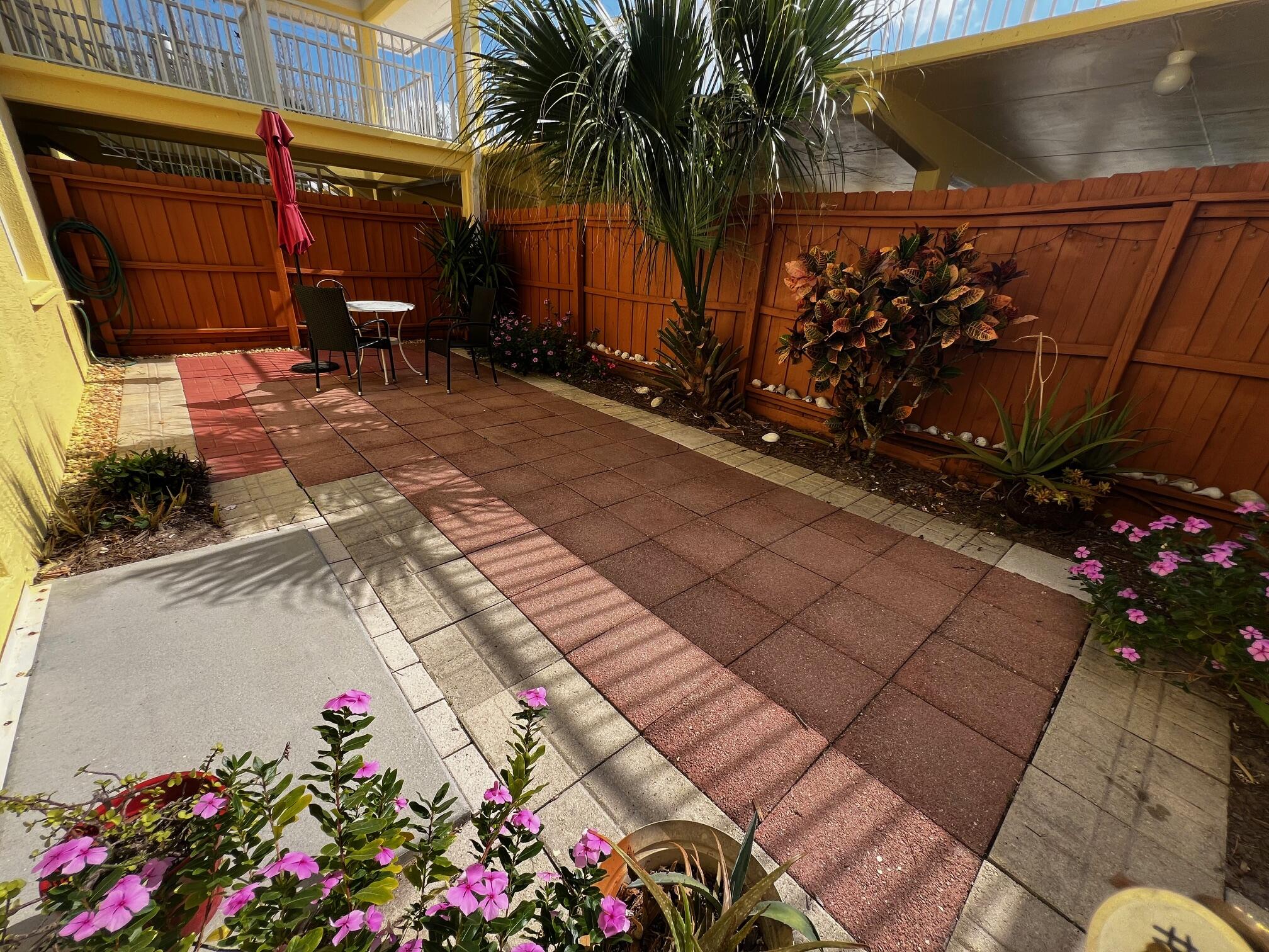 a flower pot with wooden fence