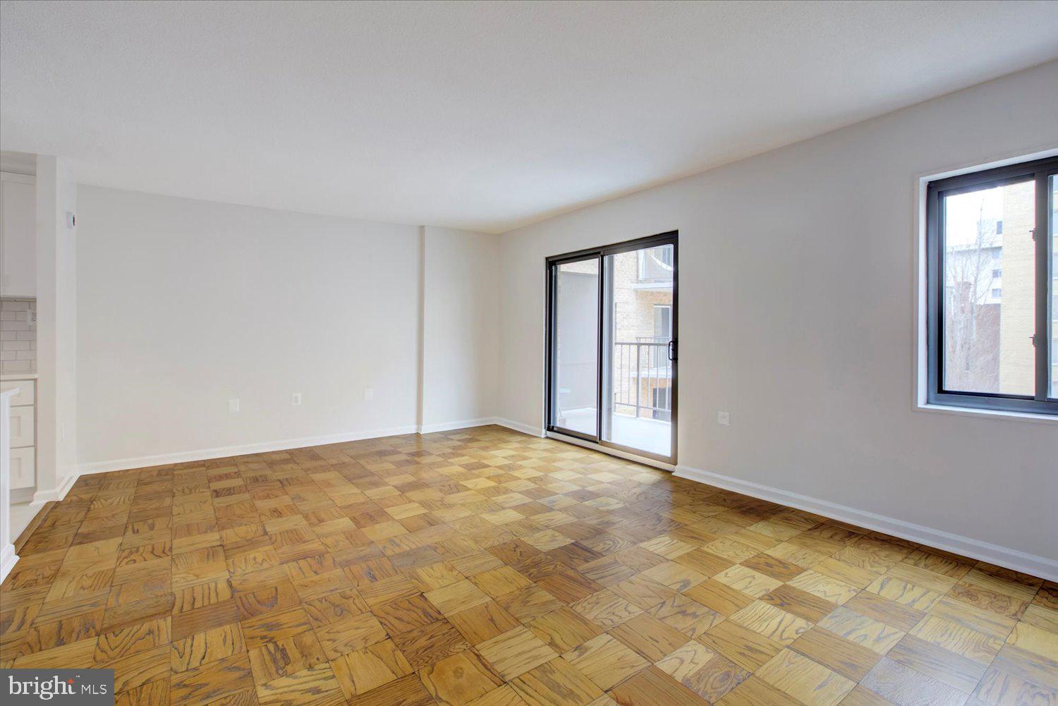 1718 P Street Northwest, Unit 411 Washington, DC 20036 - Photo 11 of 24 a view of an empty room with windows