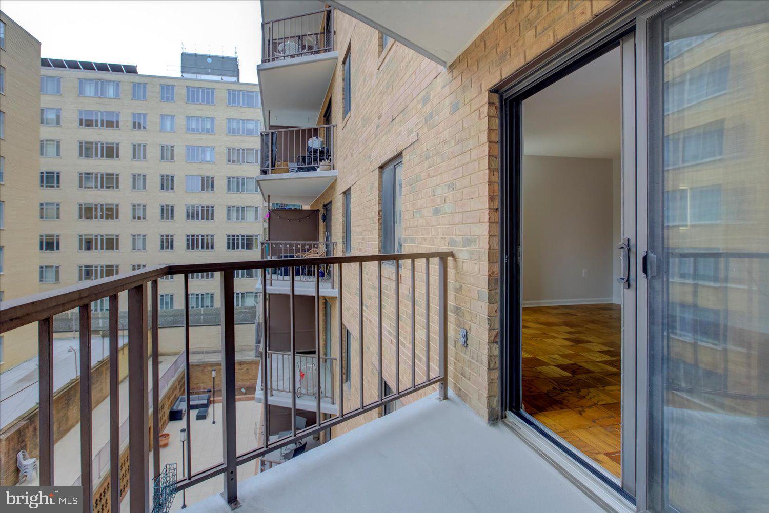 1718 P Street Northwest, Unit 411 Washington, DC 20036 - Photo 14 of 24 a view of a balcony with a potted plant