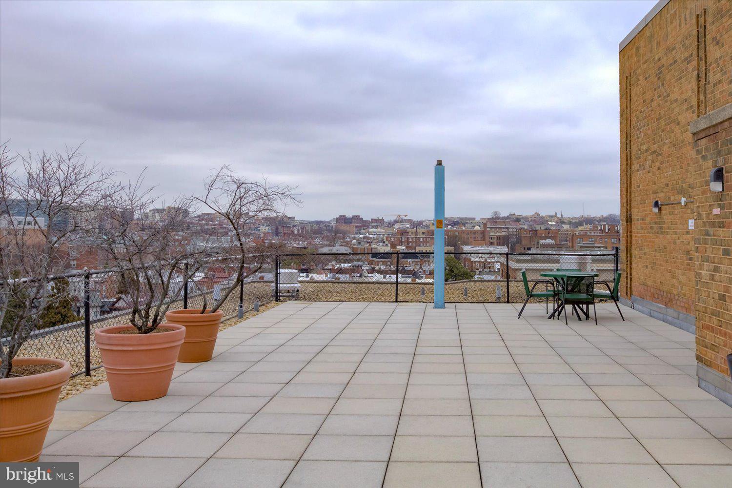 1718 P Street Northwest, Unit 411 Washington, DC 20036 - Photo 19 of 24 a view of a terrace with chairs