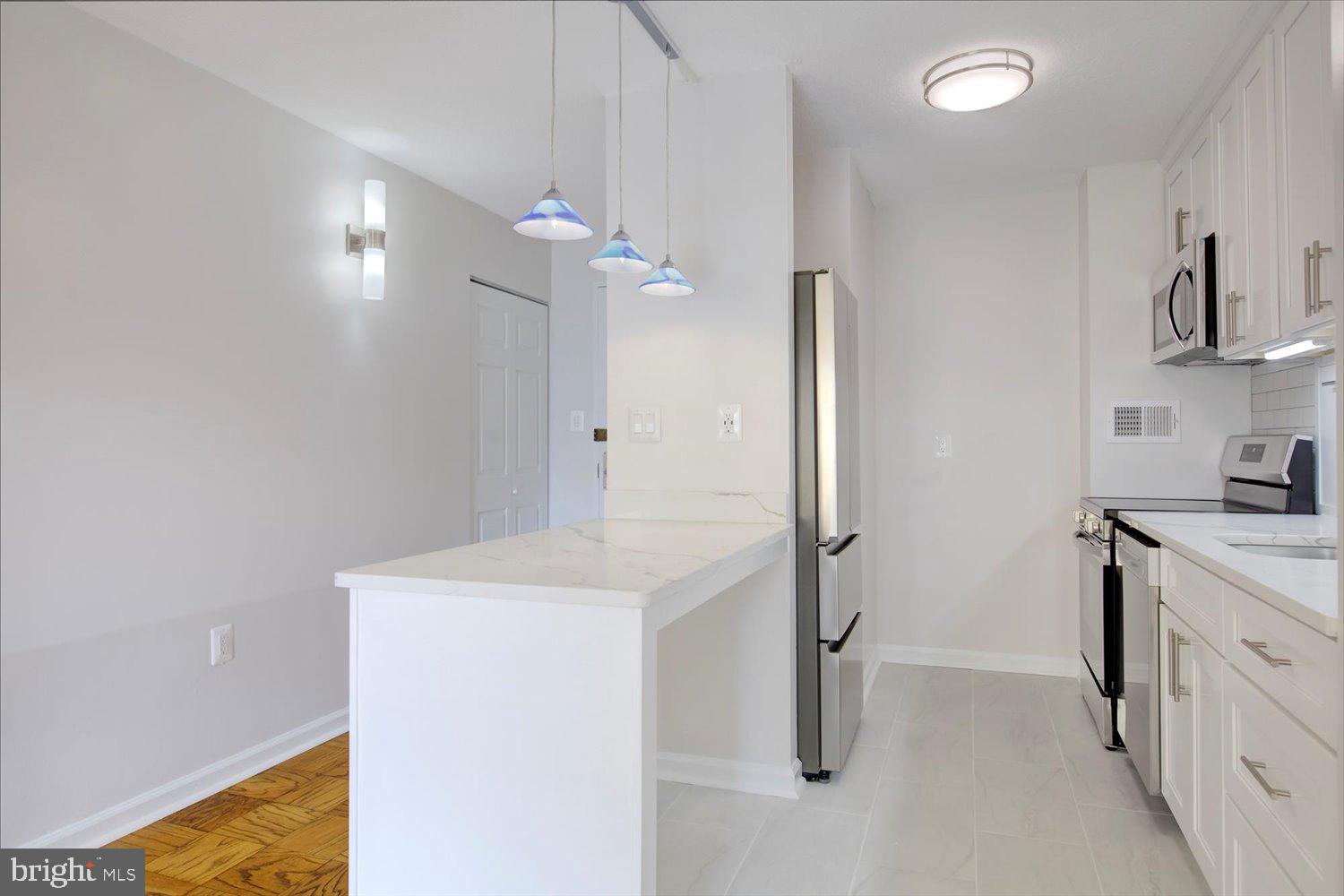 1718 P Street Northwest, Unit 411 Washington, DC 20036 - Photo 6 of 24 a bathroom with a sink a toilet and shower