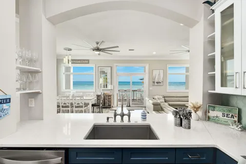 a kitchen with a sink a counter and cabinets
