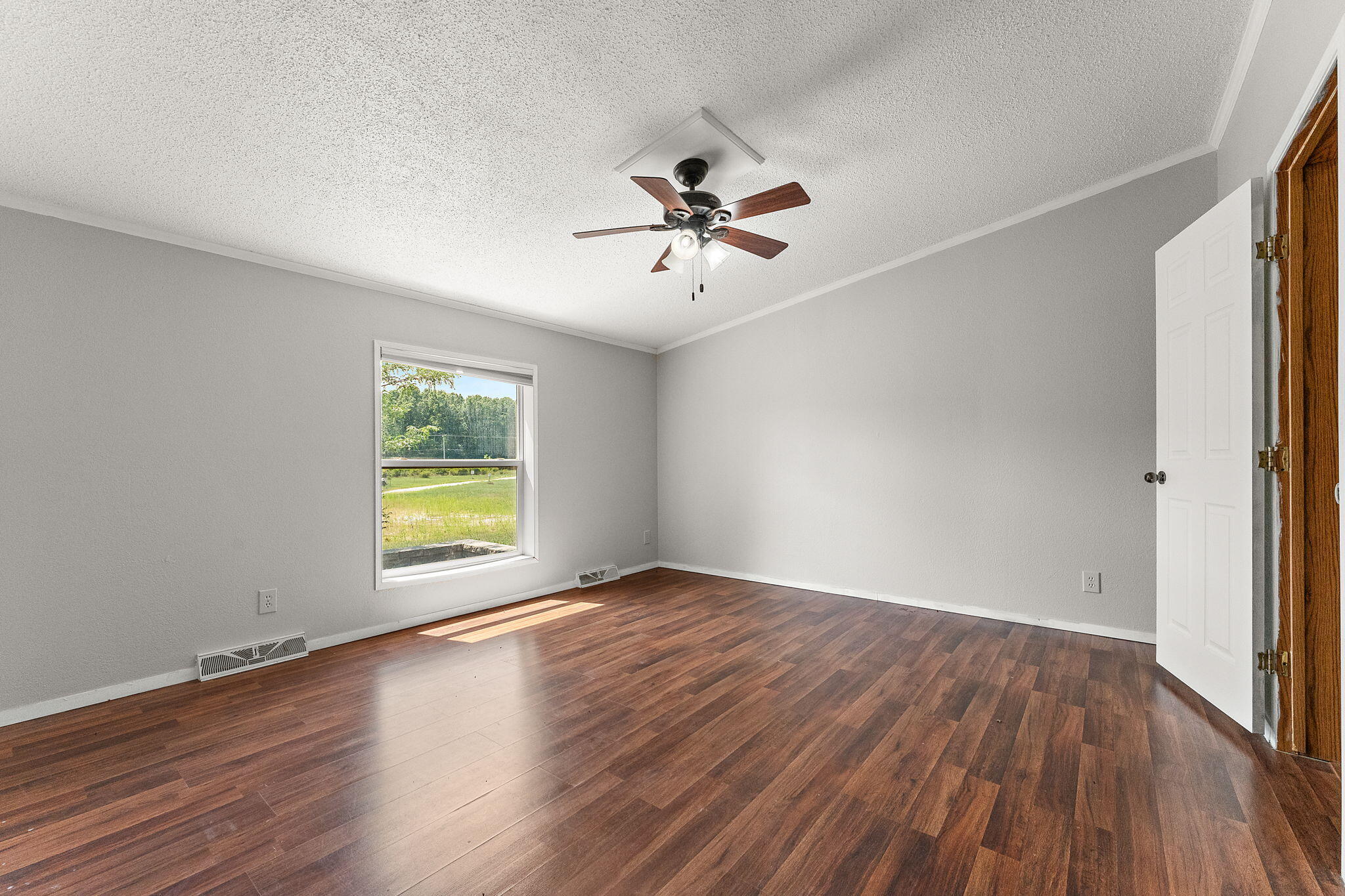 650 Freyer Road Michigan City, IN 46360 - Photo 38 of 49 wooden floor in an empty room with a window