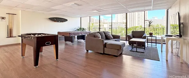 a living room with furniture and a large window