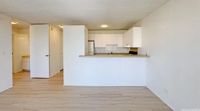 a view of a kitchen with wooden floor