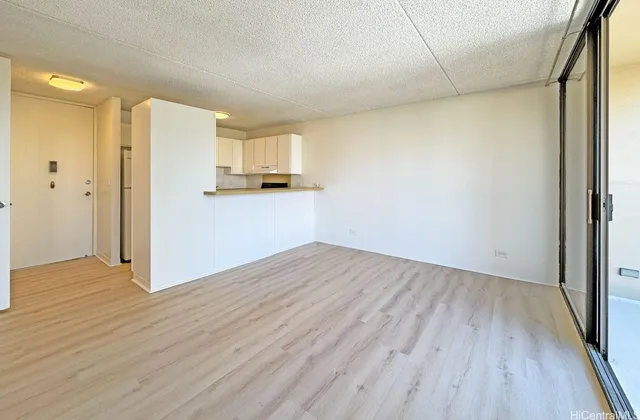 a view of kitchen and wooden floor