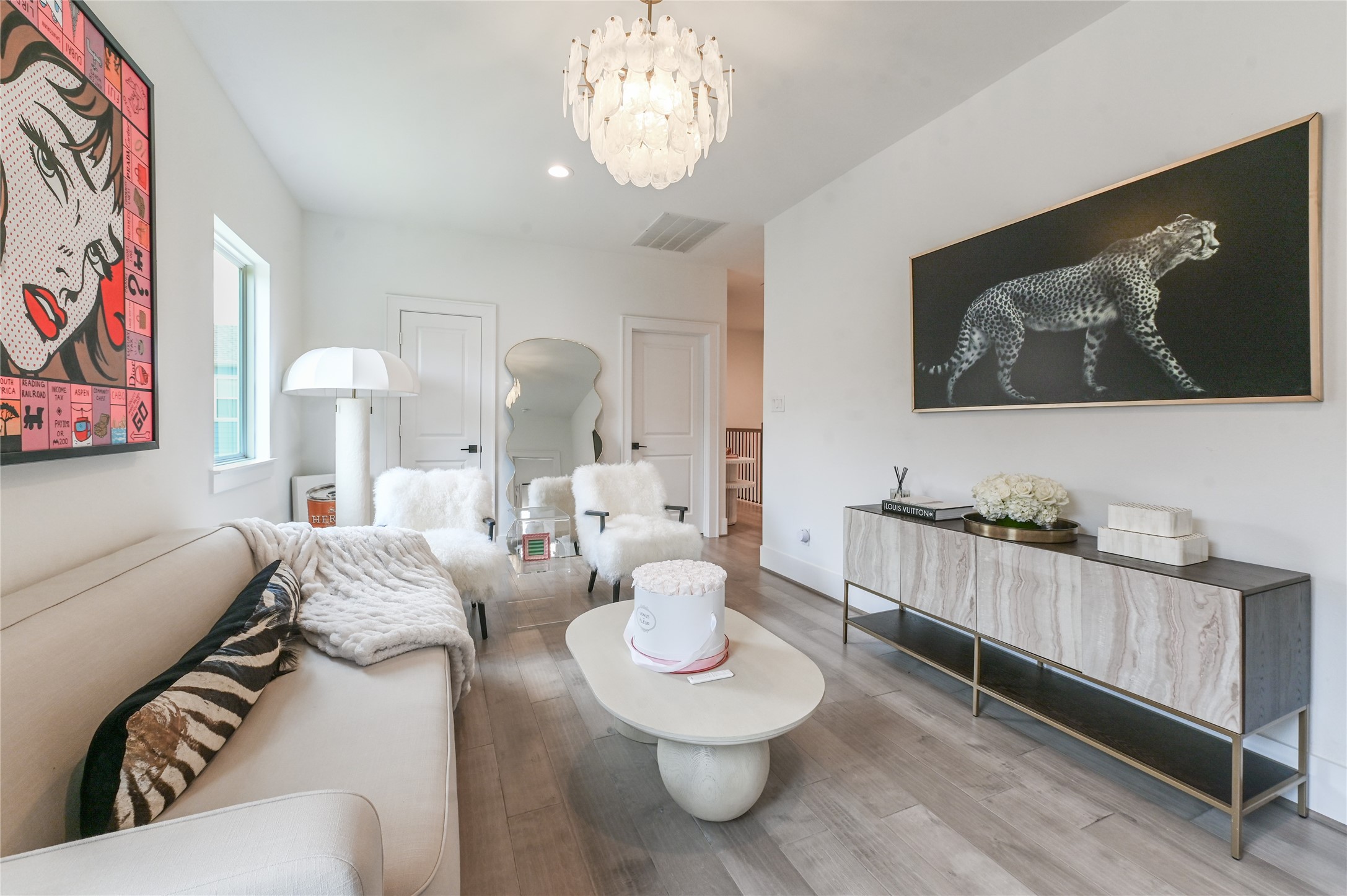 5233 Darling Street Houston, TX 77007 - Photo 14 of 34 a living room with furniture and a chandelier