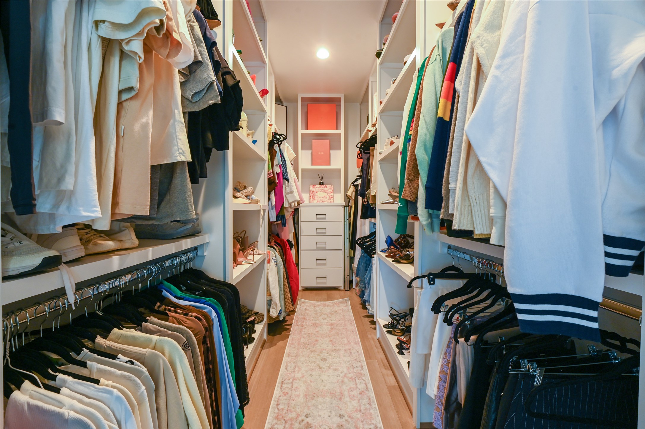 5233 Darling Street Houston, TX 77007 - Photo 22 of 34 a view of walk in closet with clothes and shoes