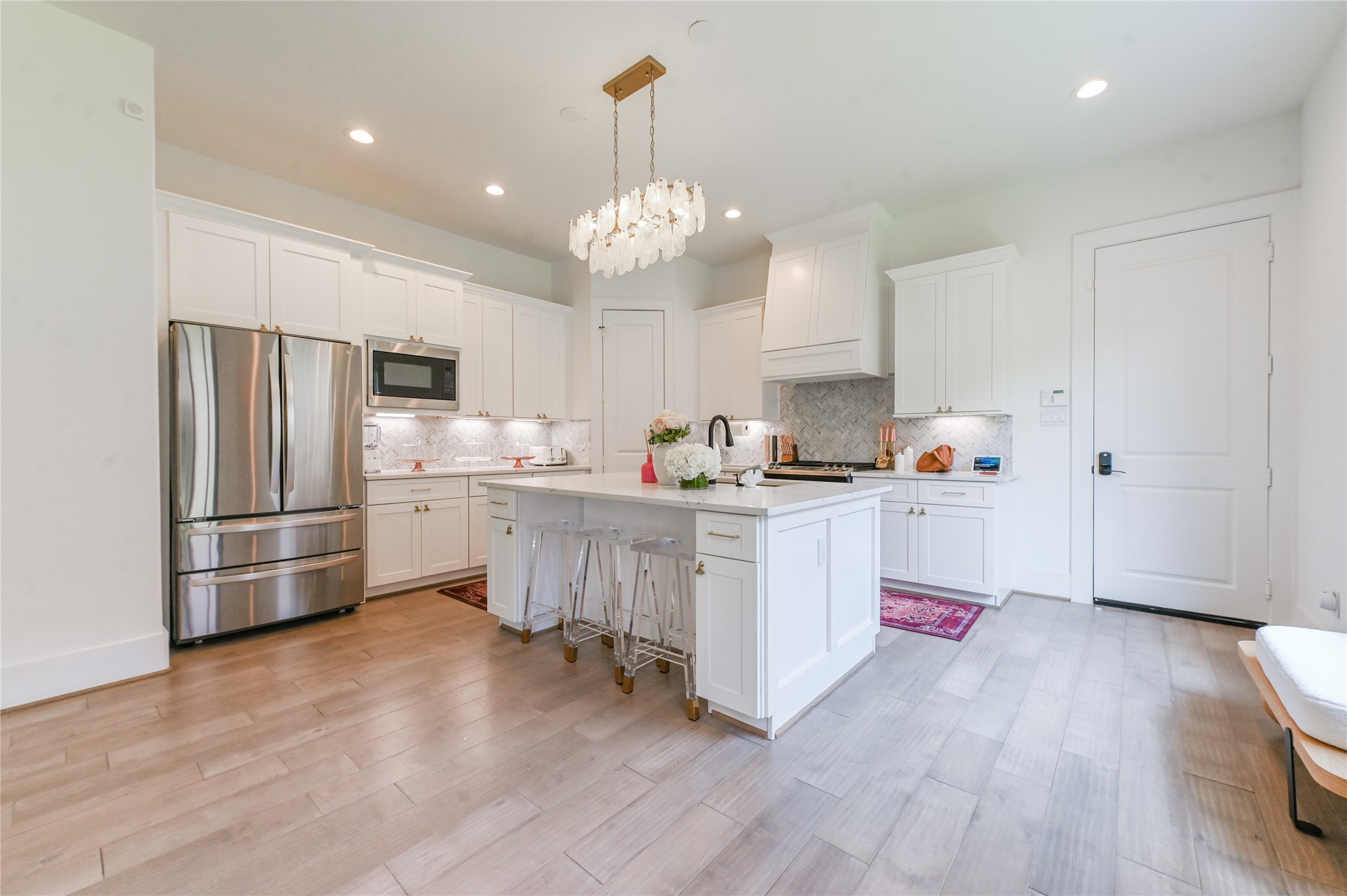 5233 Darling Street Houston, TX 77007 - Photo 4 of 34 a kitchen with refrigerator a stove a sink and dishwasher with wooden floor