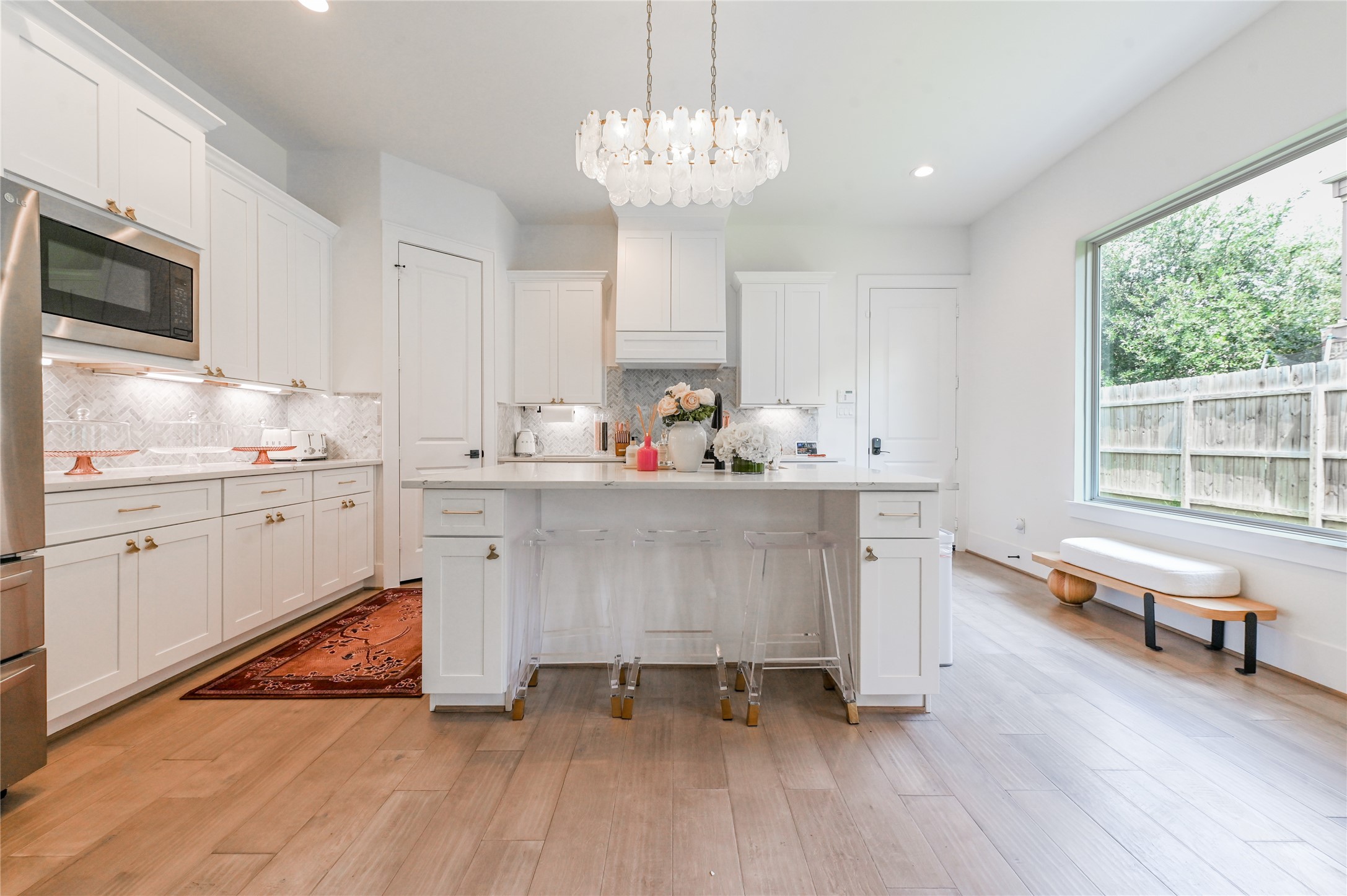 5233 Darling Street Houston, TX 77007 - Photo 7 of 34 a kitchen with a sink cabinets and window