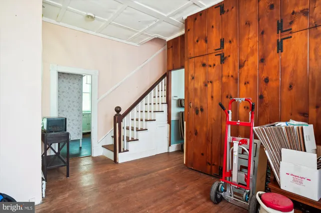 a view of an entryway with wooden floor