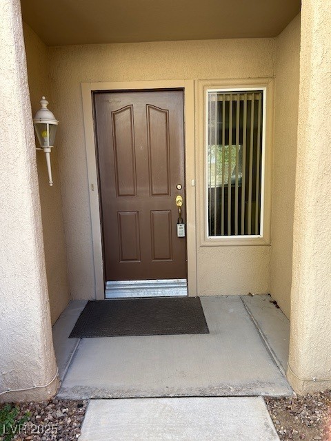 2306 Spring Water Drive Las Vegas, NV 89134 - Photo 3 of 24 Entrance to property featuring stucco siding