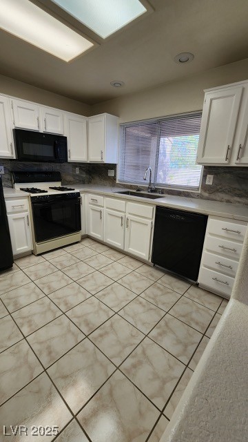 2306 Spring Water Drive Las Vegas, NV 89134 - Photo 4 of 24 Kitchen with tasteful backsplash, white cabinets, light tile patterned flooring, black appliances, and recessed lighting
