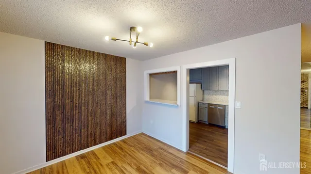 a view of an empty room and glass door