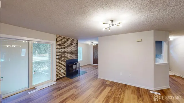 a view of hallway with wooden floor