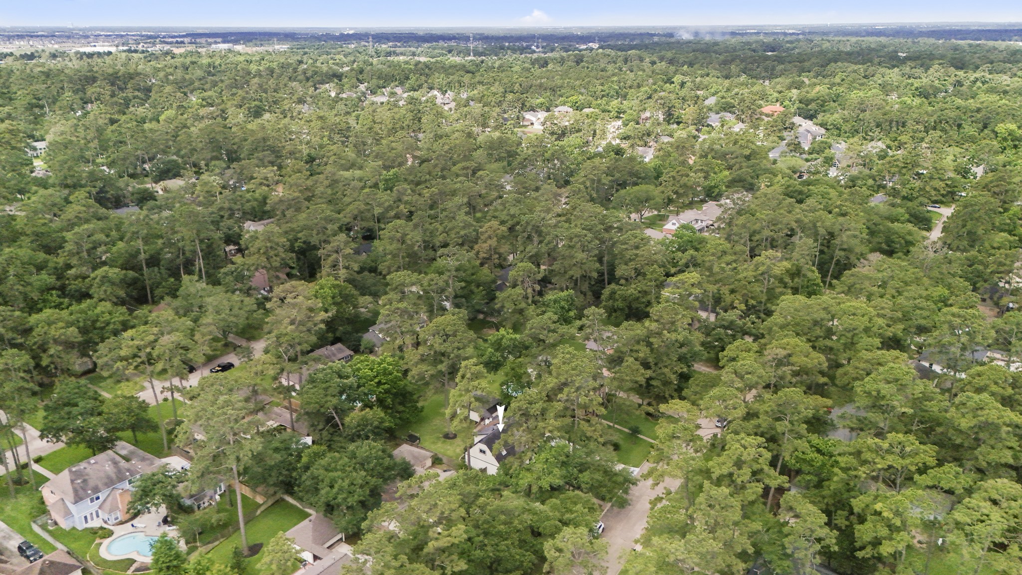 6303 Larkmount Drive Spring, TX 77389 - Photo 47 of 50 Pulling out even farther, the tree canopy around Northampton takes over the view, showing just how established and green the surrounding area feels. It’s a beautiful reminder that this home offers refreshed living inside while still being tucked into a neighborhood known for its mature trees, trails, lakes, parks, and classic Northampton charm.