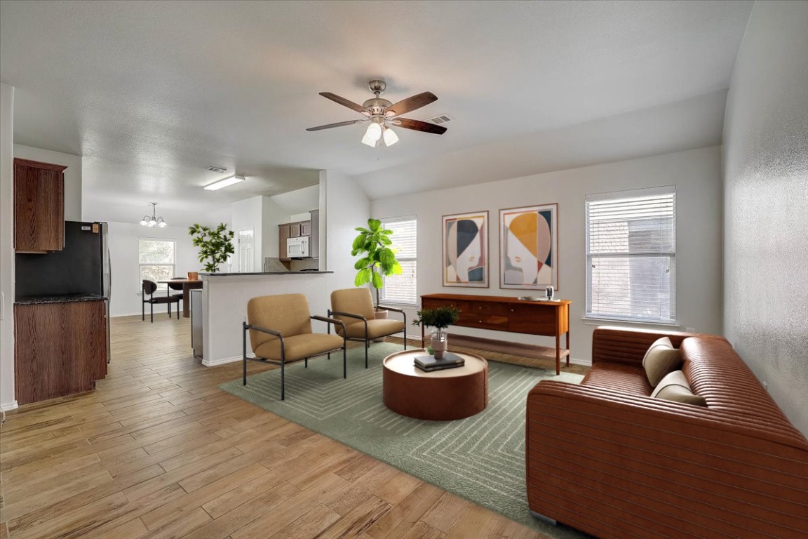5800 Silver Screen Drive Austin, TX 78747 - Photo 1 of 31 a living room with furniture a ceiling fan and a window