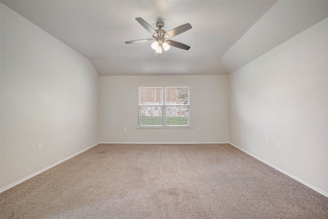 5800 Silver Screen Drive Austin, TX 78747 - Photo 16 of 31 an empty room with a window and a ceiling fan