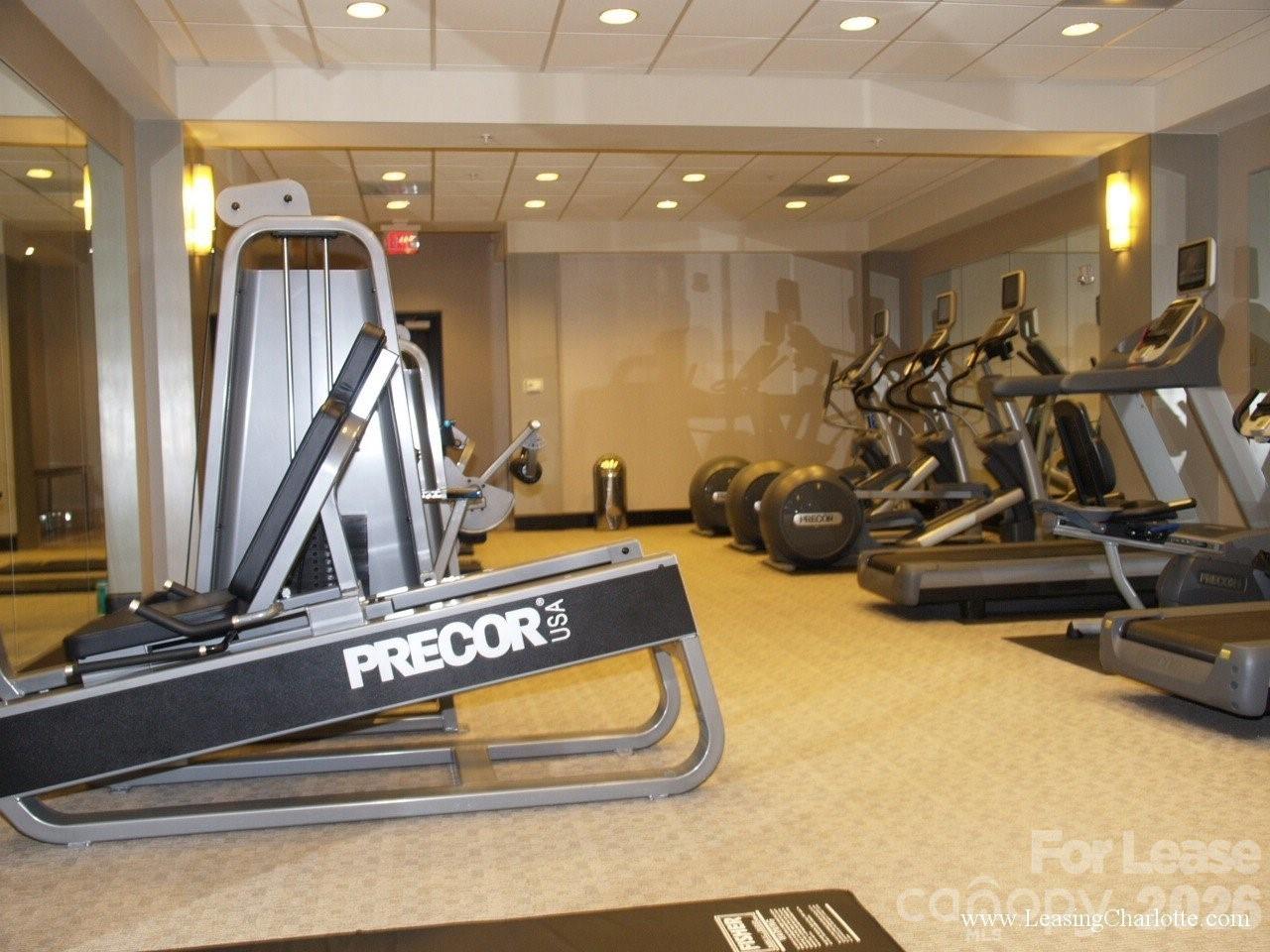 230 South Tryon Street, Unit 1002 Charlotte, NC 28202 - Photo 15 of 19 a view of a room with gym equipment