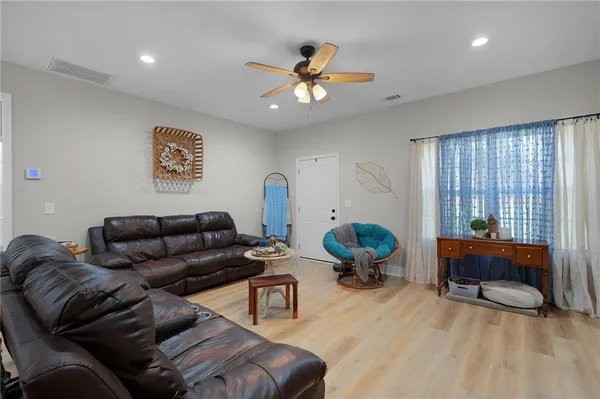 a living room with furniture and a window