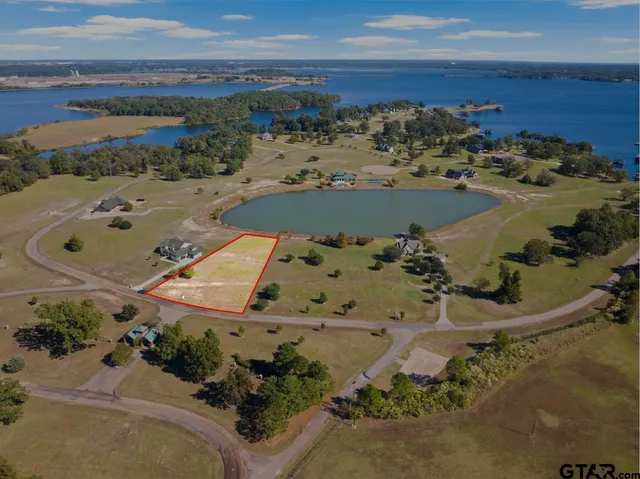 an aerial view of a house with a ocean