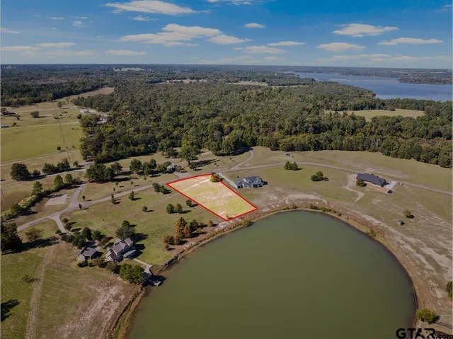 an aerial view of a house with a ocean view