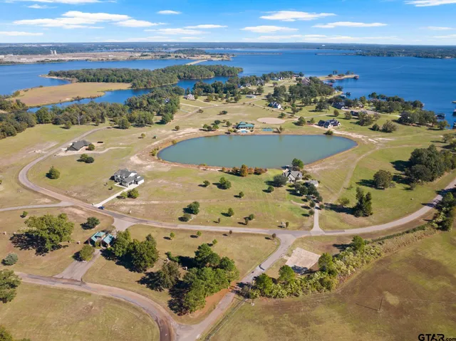an aerial view of a house with a ocean view