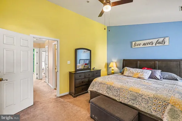 a bedroom with a bed and a dresser