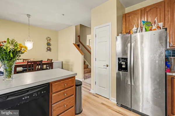 a kitchen with stainless steel appliances a refrigerator and a sink