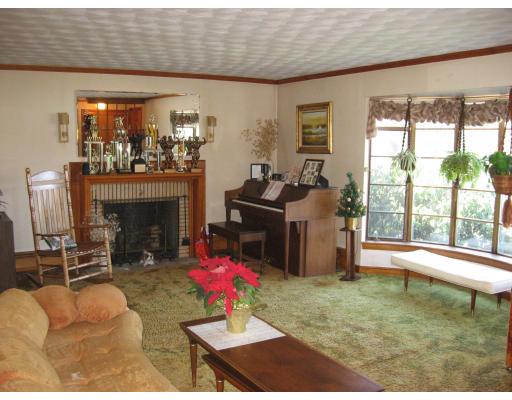 20 Sawmill Brook Road Winchester, MA 01890 - Photo 3 of 12 a living room with furniture a fireplace and floor to ceiling windows
