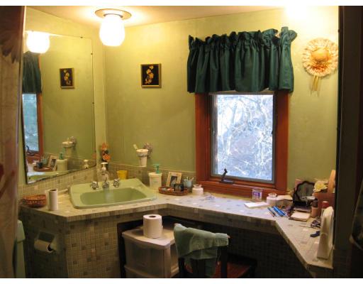 20 Sawmill Brook Road Winchester, MA 01890 - Photo 8 of 12 a bathroom with a sink and a mirror