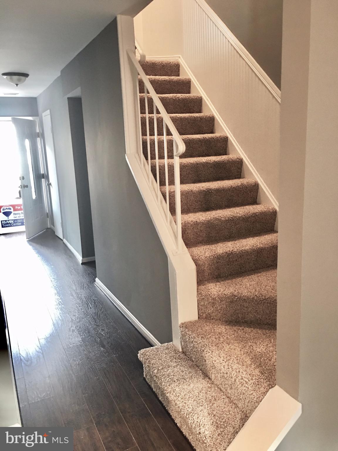 7635 Arbory Court, Unit 65 Laurel, MD 20707 - Photo 11 of 33 a view of entryway and hall with wooden floor