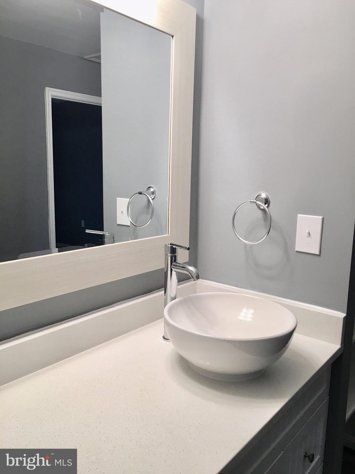 7635 Arbory Court, Unit 65 Laurel, MD 20707 - Photo 15 of 33 a bathroom with a sink and a mirror