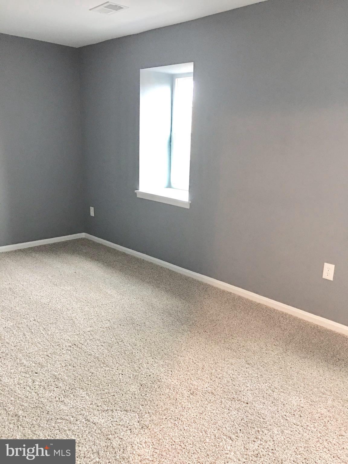 7635 Arbory Court, Unit 65 Laurel, MD 20707 - Photo 19 of 33 an empty room with a window