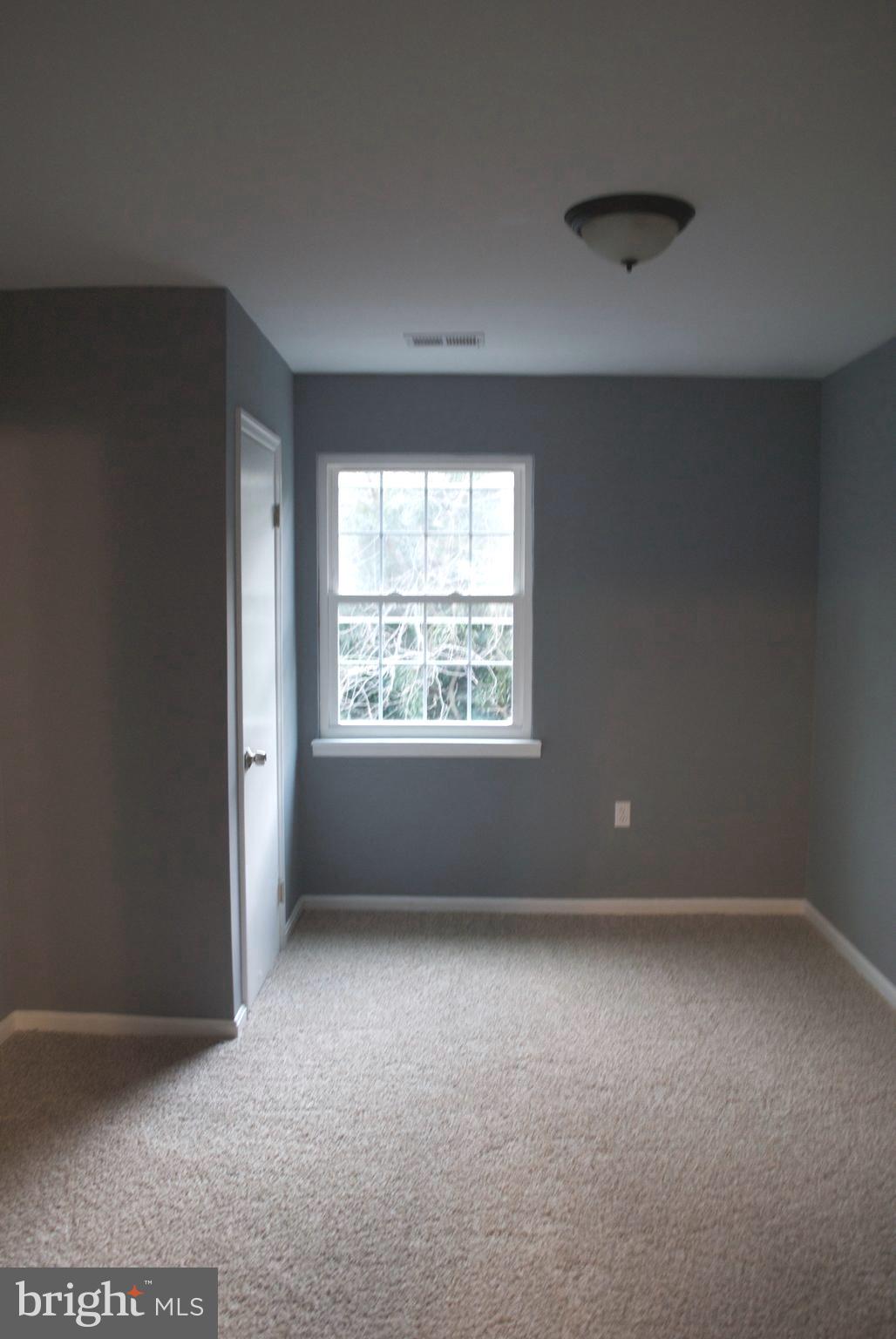 7635 Arbory Court, Unit 65 Laurel, MD 20707 - Photo 25 of 33 an empty room with a window
