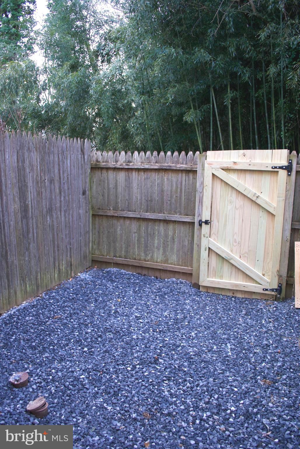 7635 Arbory Court, Unit 65 Laurel, MD 20707 - Photo 33 of 33 a view of a backyard with wooden fence