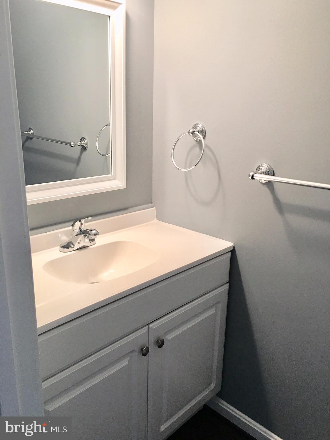 7635 Arbory Court, Unit 65 Laurel, MD 20707 - Photo 6 of 33 a bathroom with a sink and a mirror