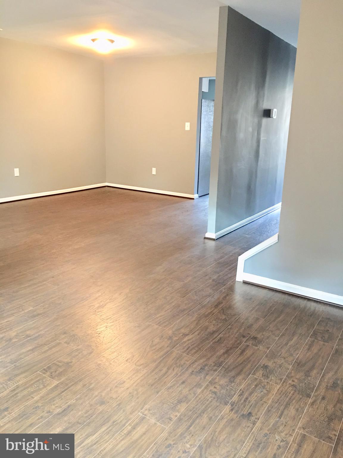7635 Arbory Court, Unit 65 Laurel, MD 20707 - Photo 10 of 33 an empty room with wooden floor