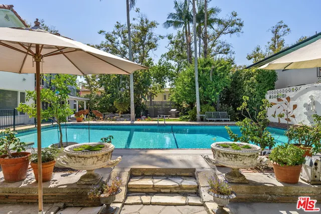 a view of an outdoor sitting area with furniture