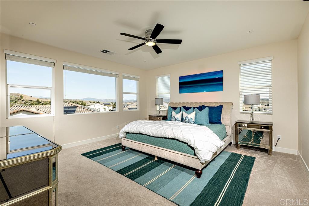 Master bedroom with full wall of windows to appreciate the open vistas.
