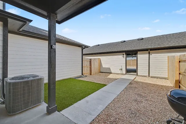 a view of a house with a yard and garage