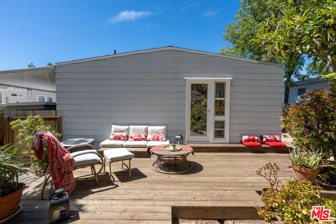 1183 Aztec Topanga, CA 90290 - Photo 29 of 68 a view of a patio with couple of chairs and potted plants