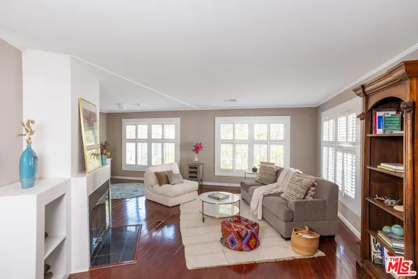 a kitchen with stainless steel appliances a sink a stove and a window