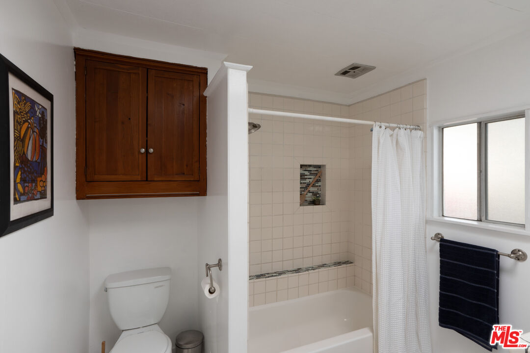 1183 Aztec Topanga, CA 90290 - Photo 34 of 68 a bathroom with a toilet and a shower
