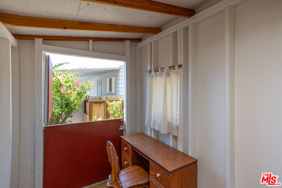 1183 Aztec Topanga, CA 90290 - Photo 36 of 68 a view of a hallway with furniture and a window